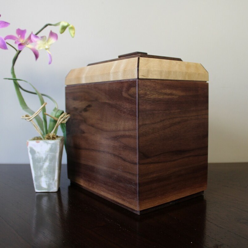 Black walnut and figured maple wooden cremation urn with keepsake compartment