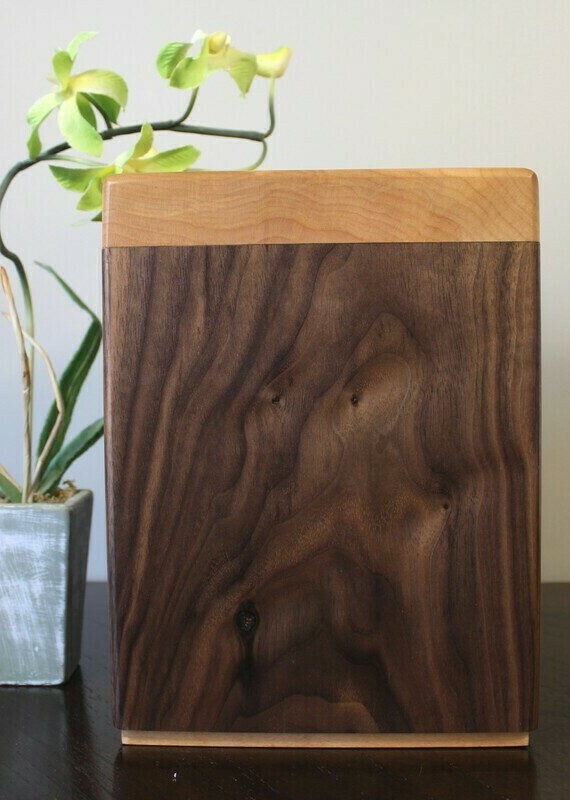 Right side view of a black walnut and flamed maple wooden cremation urn