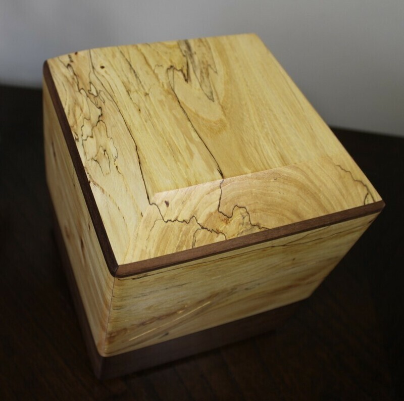 Top view of a spalted elm and black walnut wooden cremation urn