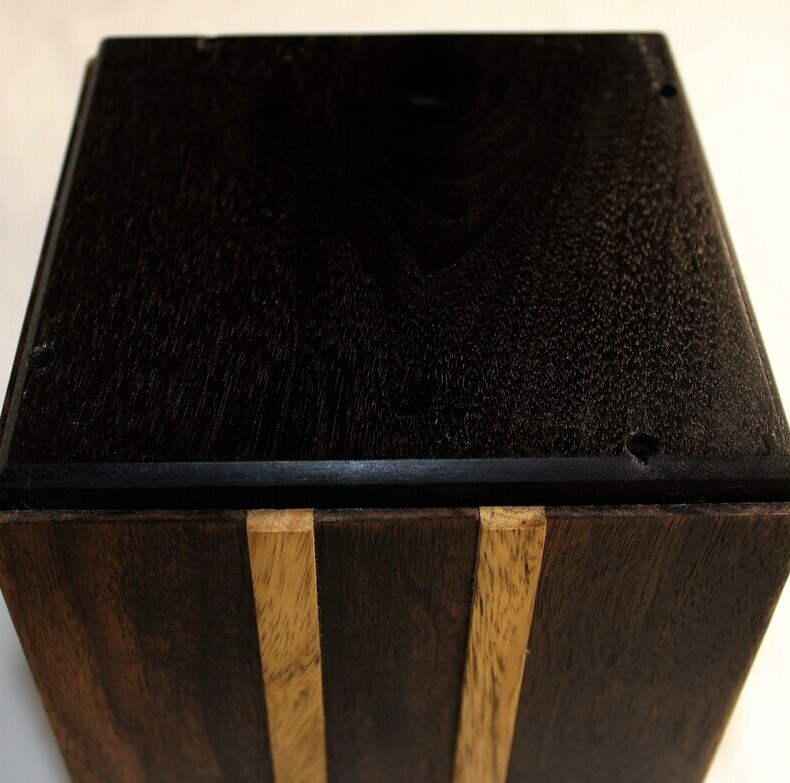 Bottom view of an ebonized black walnut and White Limba strips wooden cremation urn