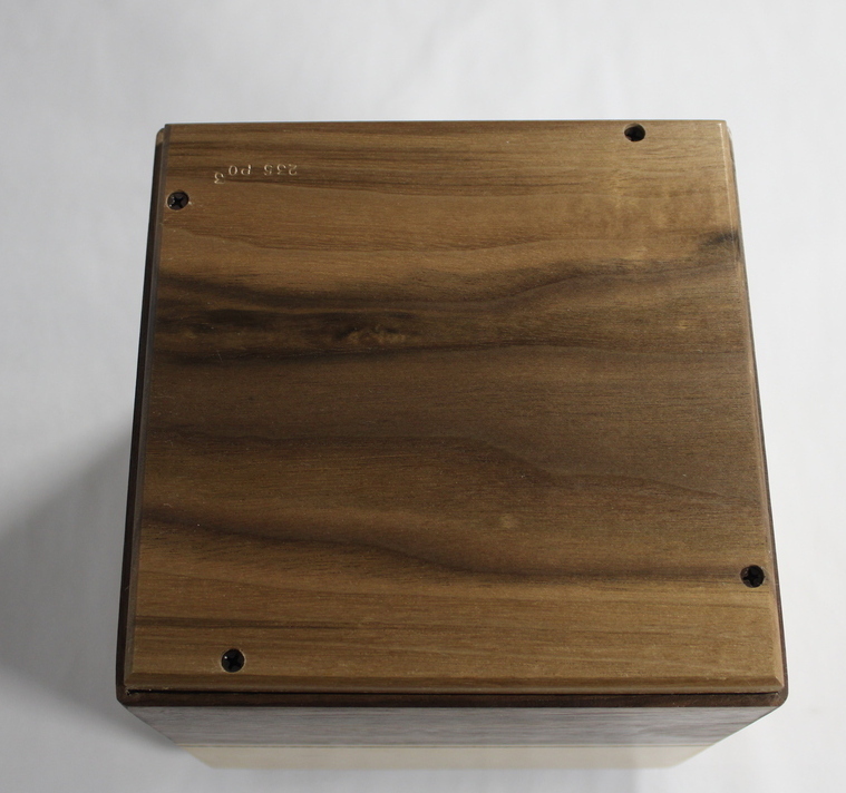 Bottom view of a black walnut and bird's eye maple wooden cremation urn