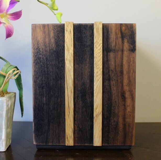 Back view of an ebonized black walnut and White Limba strips wooden cremation urn