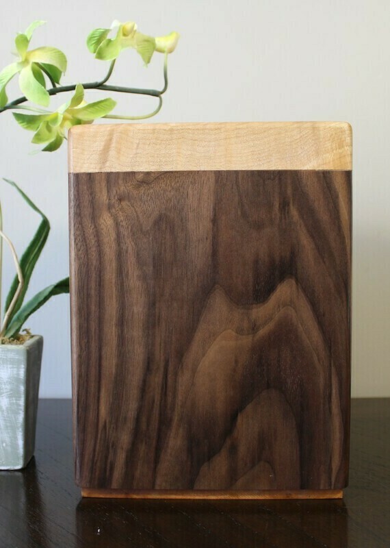 Back view of a black walnut and flamed maple wooden cremation urn