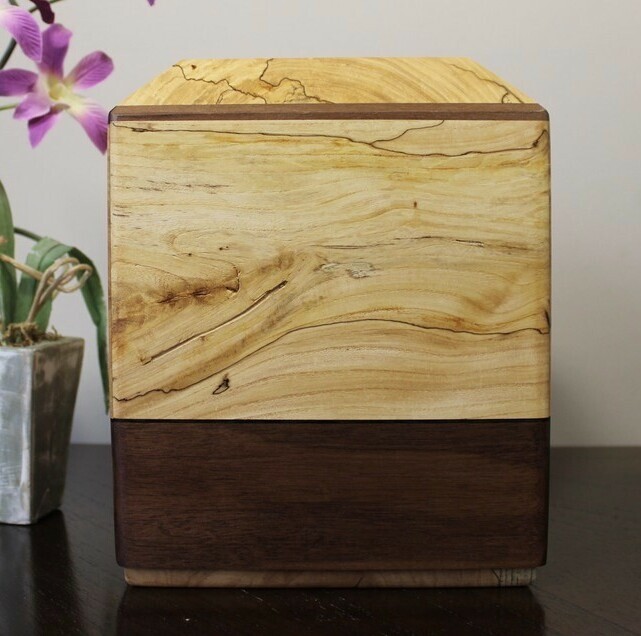 Front view of a spalted elm and black walnut wooden cremation urn