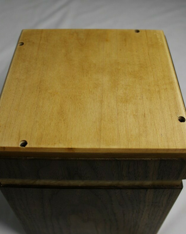 Bottom view of a black walnut and quilted maple wooden cremation urn