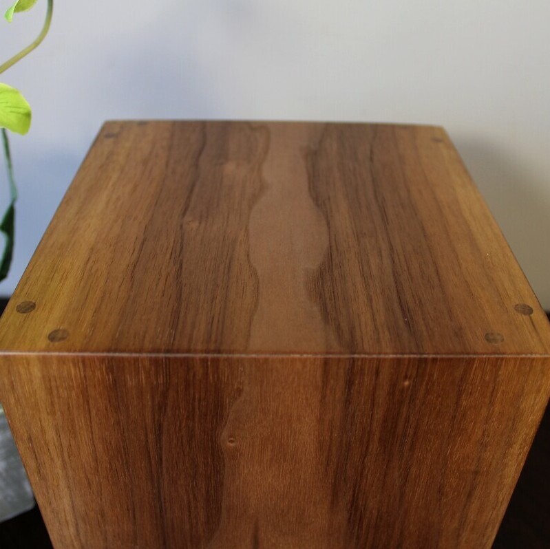 Top view of a boldly striped black Walnut wooden cremation urn