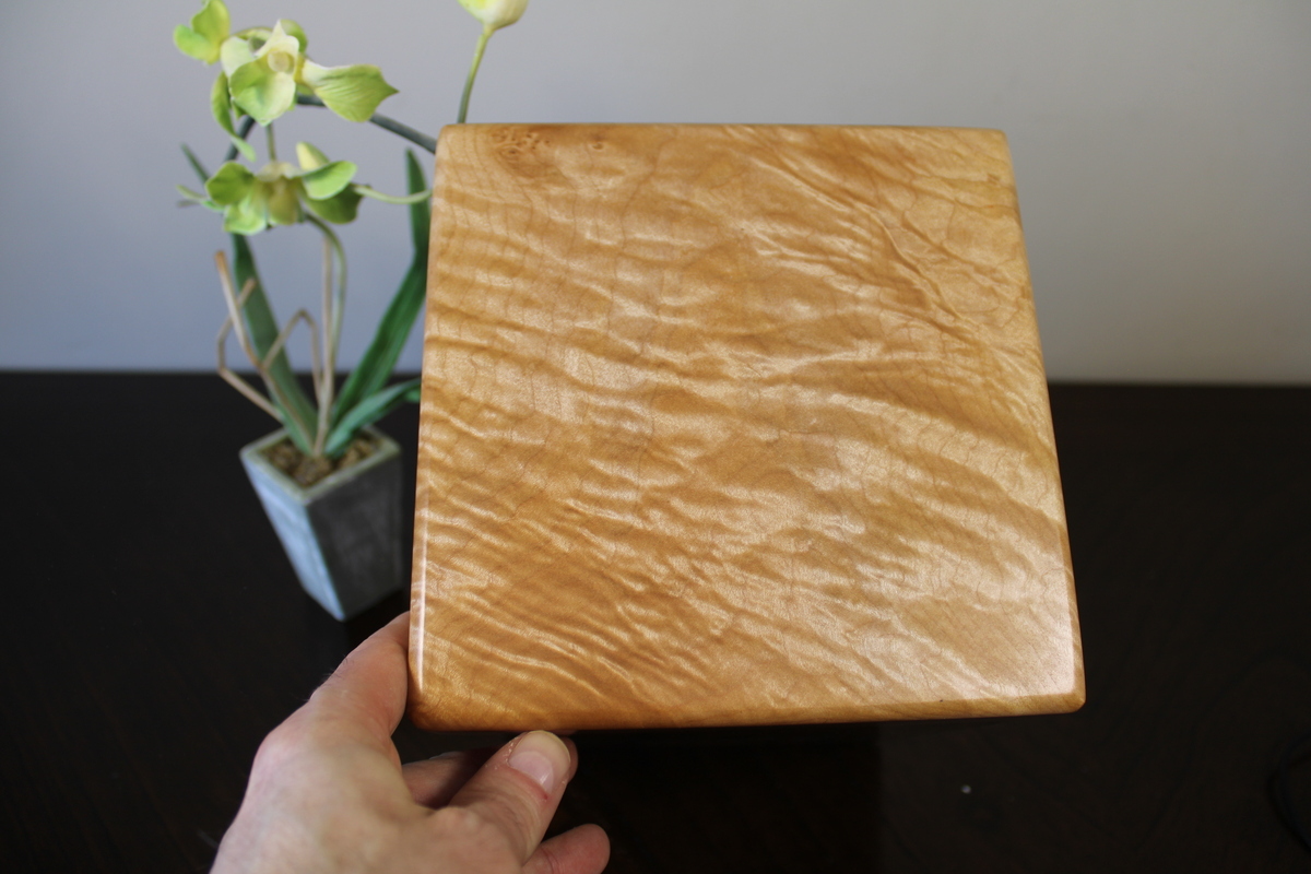 Top view of the flamed maple wooden cremation urn